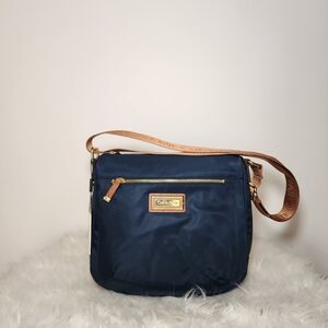 Calvin Klein Dark Blue Crossbody Bag with Tan Strap